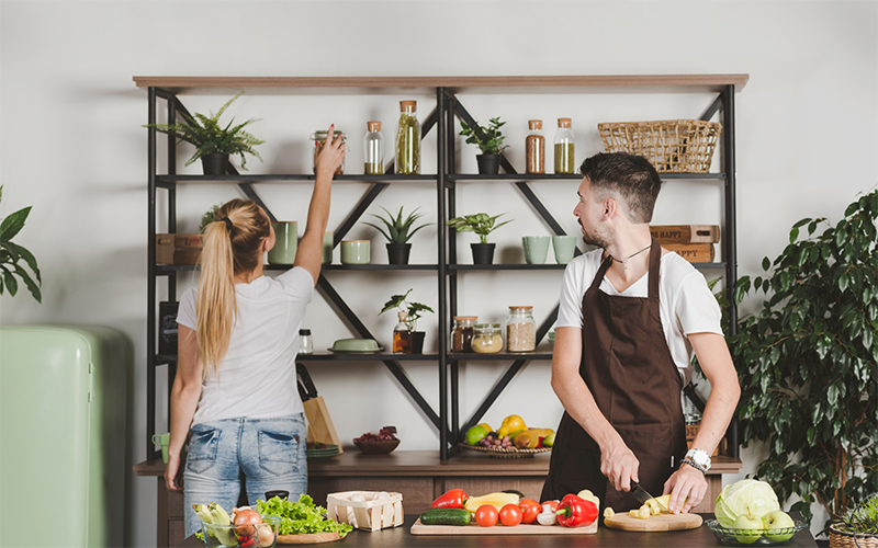 Couple Organizing Kitchen