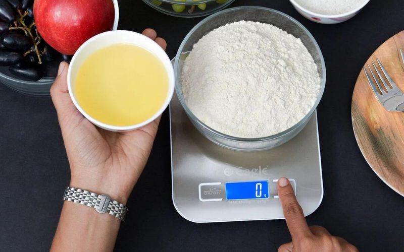 weighing flour in eagle weighing scale for baking